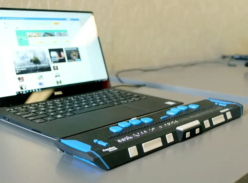 Braille display hooked up to a laptop computer