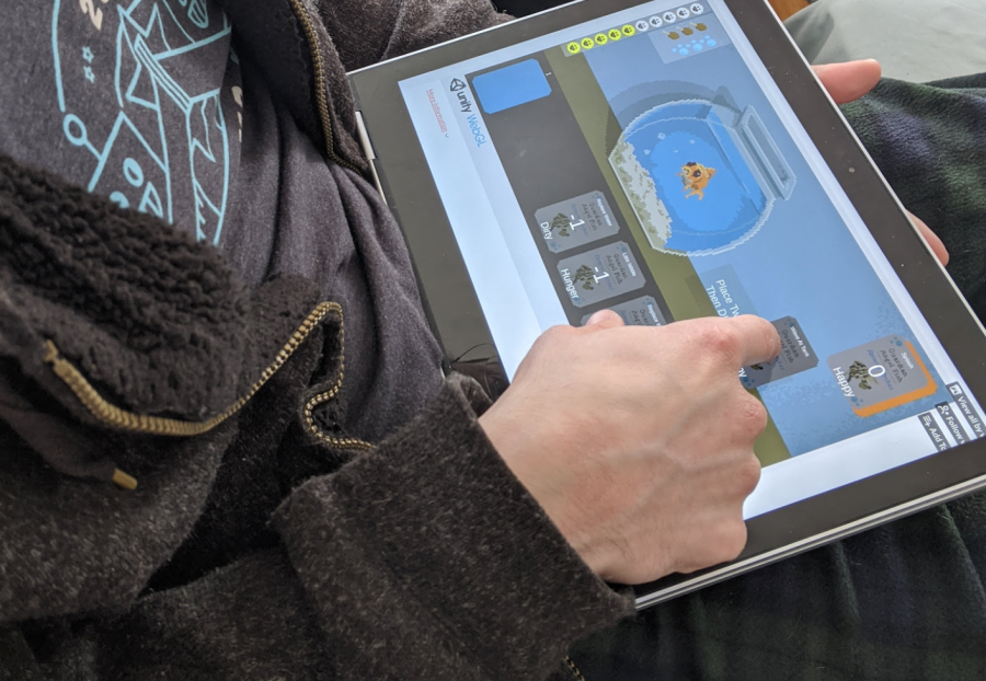 User testing an early version of a game on a tablet