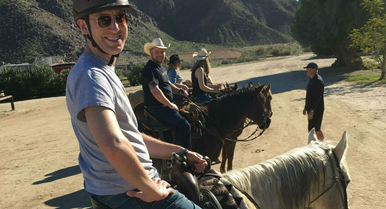 Lullabot team members posing on horseback