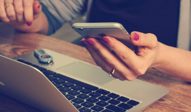 Photo of someone checking phone