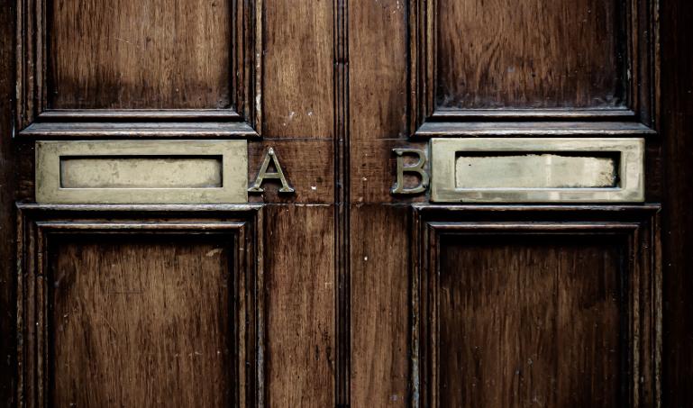 Two mail slots in a door