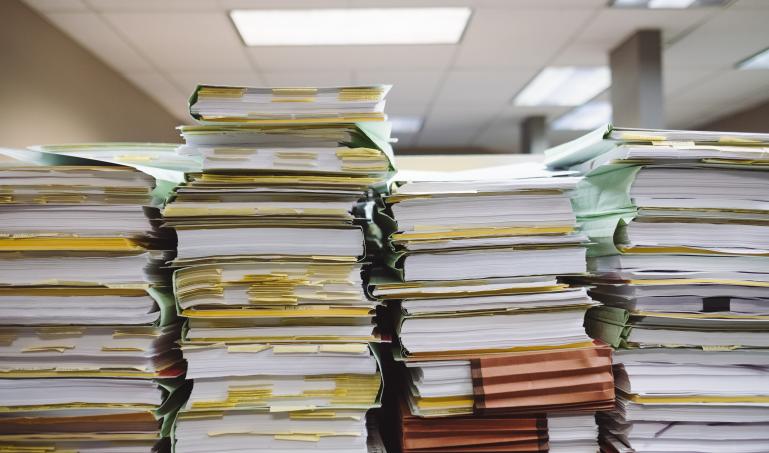 stacks of folders on desk