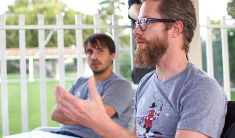 Lullabots having a discussion on a patio.