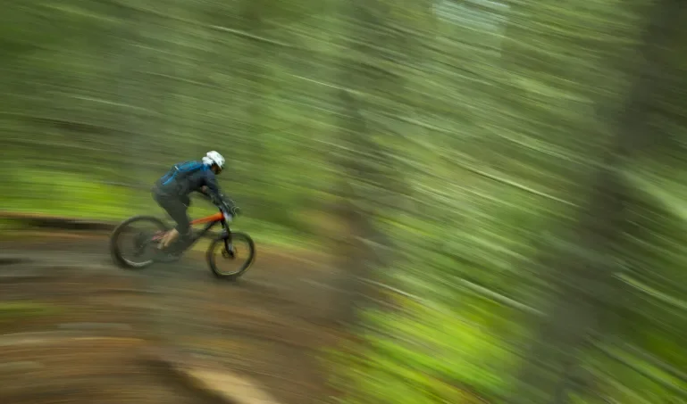 Mountain biker accelerating downhill