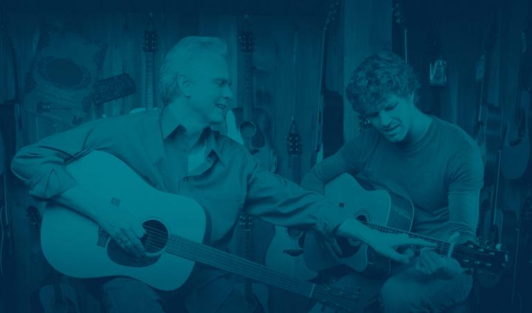 namm_hero2.jpg Acoustic guitar players, one teaching one learning.