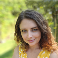 Helena McCabe with curly brown hair and green eyes