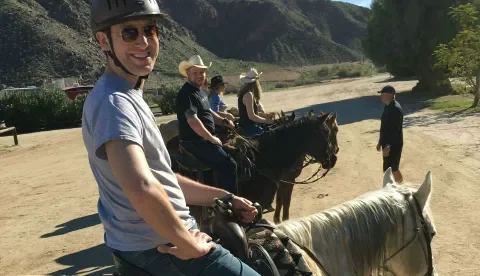 Lullabot team members posing on horseback