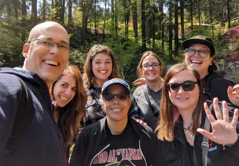 Group of Lullabots posing for a group shot in the woods in Portland, Oregon.